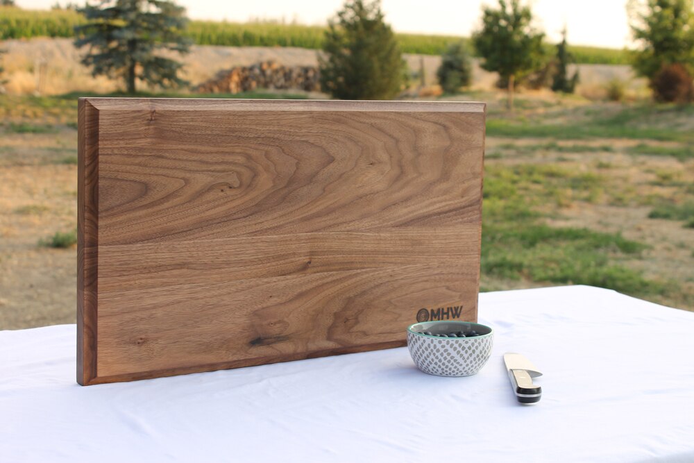 https://www.woodcuttingboardstore.com/wp-content/uploads/2020/06/14x24x1.5-Thick-Walnut-Wood-Cutting-Board-wFREE-Board-Butter4.jpg